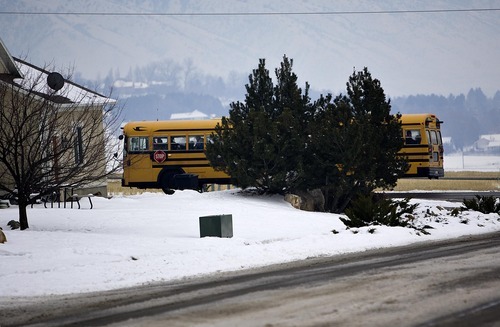 Djamila Grossman  |  The Salt Lake Tribune

When they learned that bus service would be canceled at Sunrise Elementary in Smithfield, parents banded together to run their own bus service. The bus drives around a corner in a neighborhood in Smithfield, Thursday, Jan. 13, 2011.