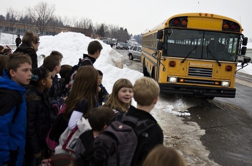 Djamila Grossman  |  The Salt Lake Tribune

When they learned that bus service would be canceled at Sunrise Elementary in Smithfield, parents banded together to run their own bus service. Kids wait as the bus pulls up in front of the school in Smithfield, Thursday, Jan. 13, 2011.