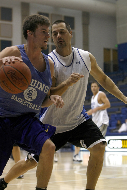 Chris Detrick  |  The Salt Lake Tribune 
Brody Van Brocklin #3 is guarded by Landsay Familar #34 during the alumni game at Salt Lake Community College Saturday January 15, 2011.  The Old Men team  defeated the Young Men team 71-65 in overtime.