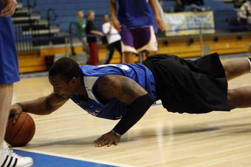 Chris Detrick  |  The Salt Lake Tribune 
Vassy Banny #50 dives for the ball during the alumni game at Salt Lake Community College Saturday January 15, 2011.  The Old Men team  defeated the Young Men team 71-65 in overtime.