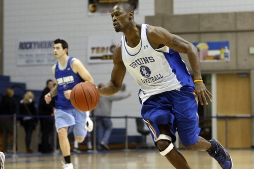 Chris Detrick  |  The Salt Lake Tribune 
Chuck Overton #34 runs the ball during the alumni game at Salt Lake Community College Saturday January 15, 2011.  The Old Men team  defeated the Young Men team 71-65 in overtime.