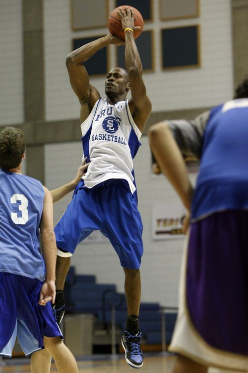 Chris Detrick  |  The Salt Lake Tribune 
Chuck Overton #34 shoots over Brody Van Brocklin #3 during the alumni game at Salt Lake Community College Saturday January 15, 2011.  The Old Men team  defeated the Young Men team 71-65 in overtime.