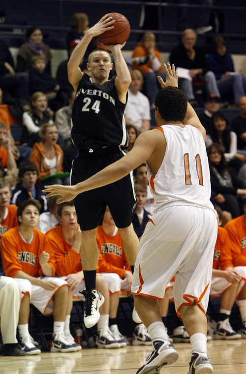 Chris Detrick  |  The Salt Lake Tribune 
Riverton's Stephan Holm #24 shoots over Brighton's Loi Masina #11 during the game at Brighton High School Tuesday December 14, 2010.