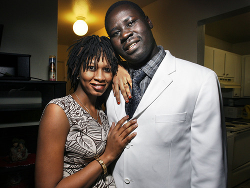 Scott Sommerdorf  l  The Salt Lake Tribune
Jongkor Kuot Mayol poses with his wife, Abak Garang, in their Salt Lake City apartment on Sunday. Mayol is among thousands of southern Sudanese who traveled to cities around the United States to vote for southern Sudan's independence.