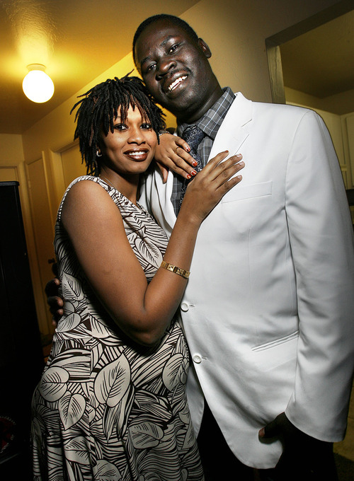 Scott Sommerdorf  l  The Salt Lake Tribune
Jongkor Kuot Mayol poses with his wife, Abak Garang, in their Salt Lake City apartment on Sunday. Mayol is among thousands of southern Sudanese who traveled to cities around the United States to vote for southern Sudan's independence.