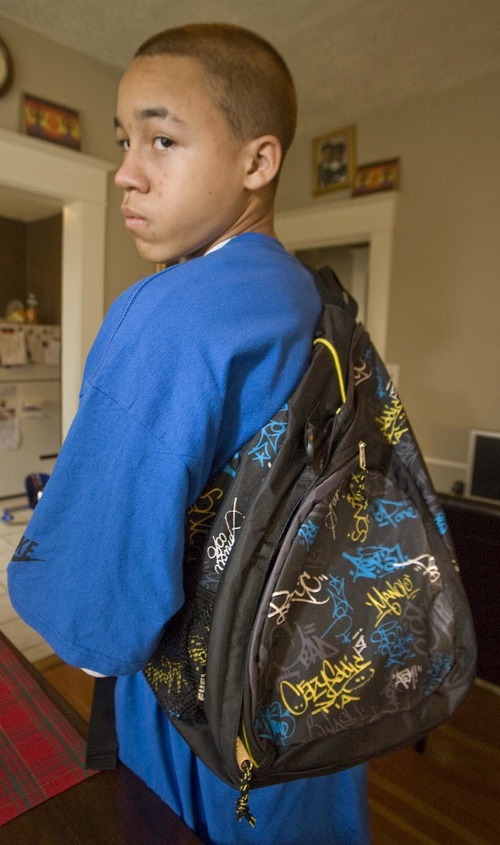 Paul Fraughton  |  The Salt Lake Tribune
West High student Kaleb Winston shows off his backpack, which was an early Christmas gift from his parents, last month. Police claimed the artwork on the bag had gang significance. Kaleb was questioned at the school Dec. 16 as part of a community policing effort to dissuade kids from participating in gang activity.