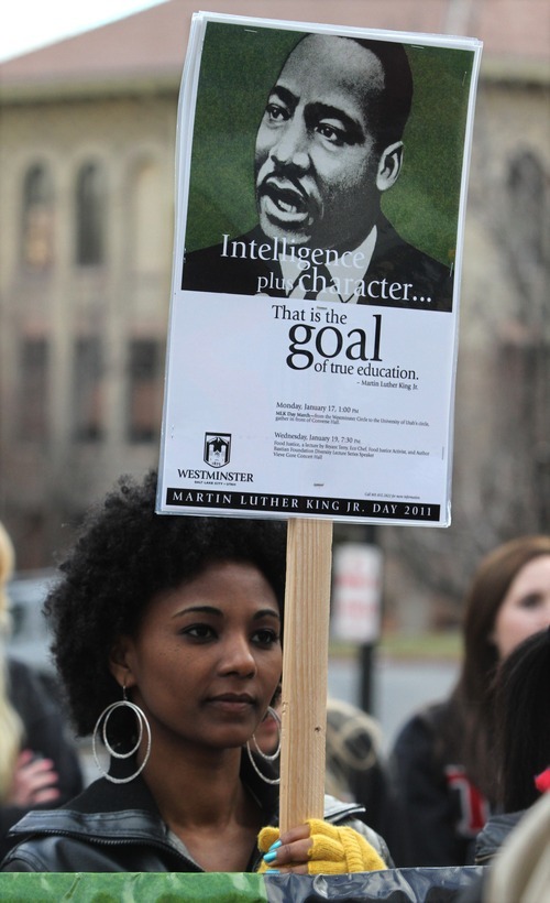 Rick Egan   |  The Salt Lake Tribune
Westminster college student Tirhas Miteku holds a sign as she listens to speakers at the Park Building at the University of Utah