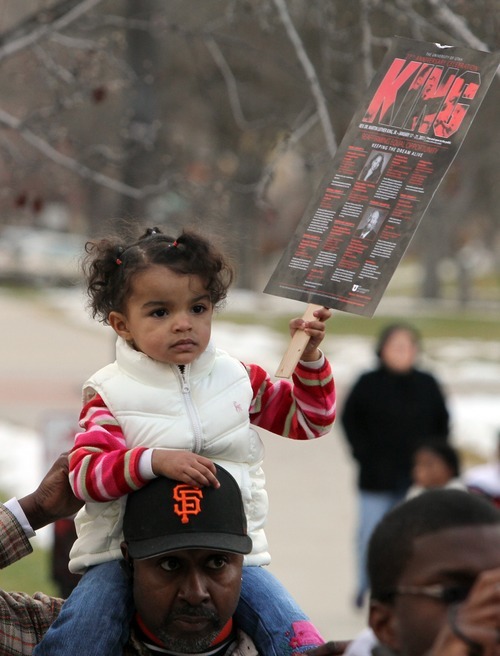 Rick Egan   |  The Salt Lake Tribune

2-year-old Jada Swagerty sits on her father Craig's  shoulders, at the Park building at the University of Utah during the Martin Luther King Jr. March,  Monday, Jan. 17, 2011.