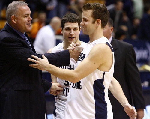Djamila Grossman  |  The Salt Lake Tribune

BYU's head coach Dave Rose congratulates his players Jackson Emery, 4, and Jimmer Fredette, 32, after the team won against the University of Texas at El Paso in Provo, Thursday, Dec. 23, 2010.