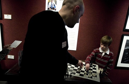Djamila Grossman  |  The Salt Lake Tribune
Chess grandmaster Alexander Shabalov plays chess with Andrew Roach, 8, of North Salt Lake, at the Thomas Kearns McCarthey Gallery in Park City Friday. The event was organized by the World Chess Hall of Fame and Museum to support the premiere of 
