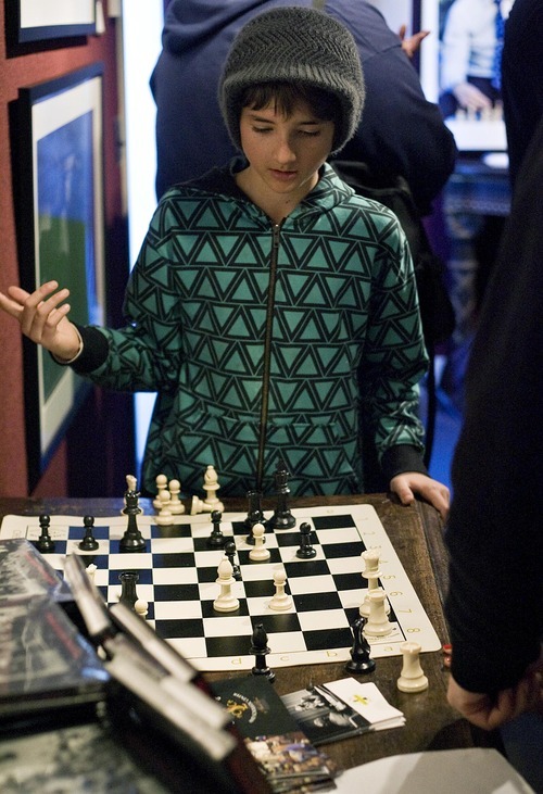 Djamila Grossman  |  The Salt Lake Tribune
Sam Mason, 10, of Park City, plays chess with chess grandmaster Alexander Shabalov at the Thomas Kearns McCarthey Gallery in Park City Friday. The event was organized by the World Chess Hall of Fame and Museum to support the premiere of 