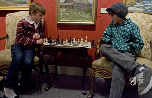 Djamila Grossman  |  The Salt Lake Tribune
Andrew Roach, 8, of North Salt Lake, left, and Sam Mason, 10, of Park City, play chess at the Thomas Kearns McCarthey Gallery in Park City Friday. The event was organized by the World Chess Hall of Fame and Museum to support the premiere of 