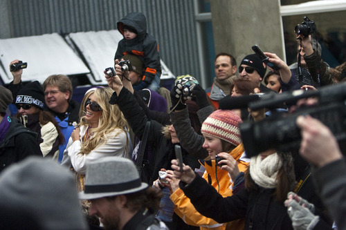 Chris Detrick  |  The Salt Lake Tribune 
Festival-goers take pictures as the Salt Lake City Flash Mob dances during the Sundance Film Festival on Saturday, Jan. 22, 2011.