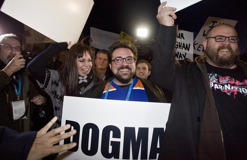 Djamila Grossman  |  The Salt Lake Tribune

Director Kevin Smith and supporters holds signs as they face off with protesters before the premiere of his movie 