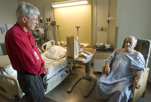 Paul Fraughton  |  The Salt Lake Tribune
Bill Kleinschmidt, left, talks with a patient in the University of Utah Medical Center. Bill is a volunteer in the hospital's elder life program (HELP) aiding the patient  with their ensory needs, helping them stay oriented to their surroundings.