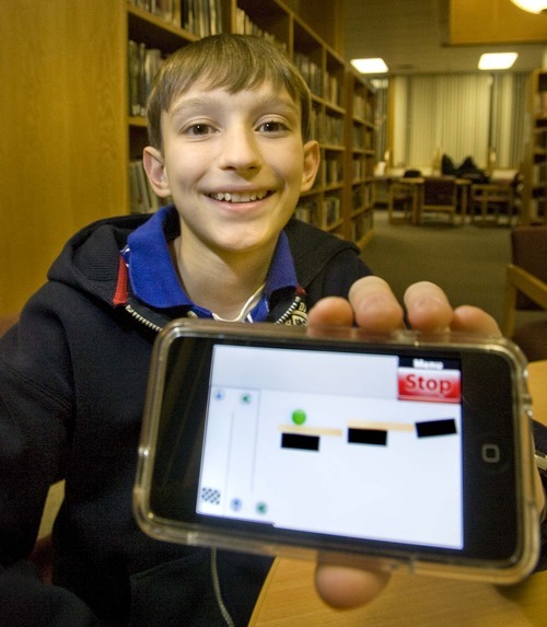 Paul Fraughton  |  The Salt Lake Tribune
Robert Nay, a Spanish Fork junior high student, shows off the game he created for the iPhone. The game, called 