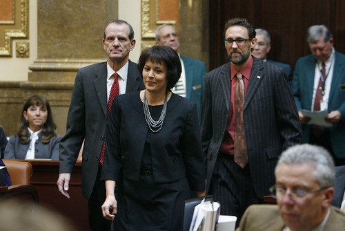 SCOTT SOMMERDORF l The Salt Lake Tribune
Becky Lockhart is escorted to the speaker's chair by Brad Dee, left, and David Litvack, right, during the opening day of the Utah Legislature. Lockhart on Monday became the first female House speaker in Utah history. She is one of only three women in that post nationally.