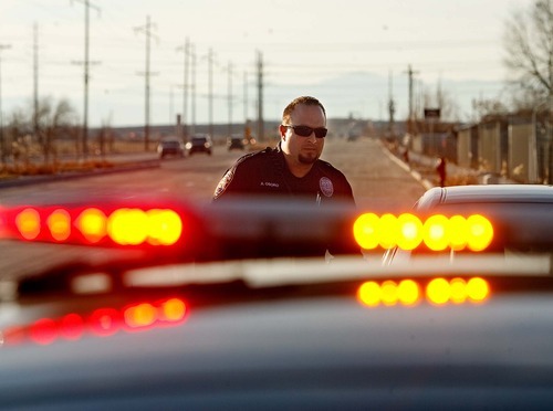 Trent Nelson  |  The Salt Lake Tribune
Woods Cross police officer Adam Osoro working a traffic stop Thursday, January 20, 2011.