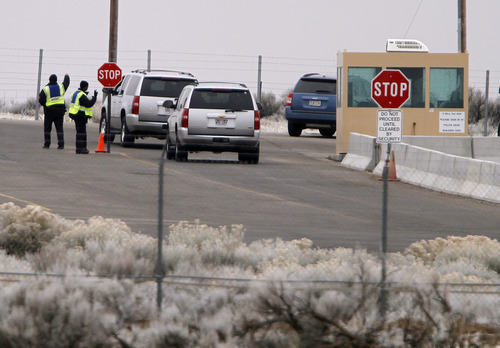 Jim Urquhart  |  The Associated Press
Vehicles are stopped at the main gate at Dugway Proving Ground military base Thursday, Jan. 27, 2010, about 85 miles southwest Salt Lake City, Utah. The military base, which carries out tests to protect troops against biological agents and biological attacks, was locked down overnight because a small amount of a nerve agent was unaccounted for. The missing vial prompted a lockdown late Wednesday afternoon that lasted until the agent was found early Thursday. The Army says no one was in danger and the lockdown was ordered as a precaution.