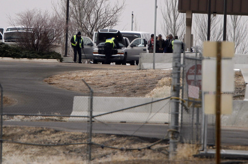Jim Urquhart  |  The Associated Press
Vehicles are searched before exiting the main gate at Dugway Proving Ground military base Thursday, Jan. 27, 2010, about 85 miles southwest Salt Lake City, Utah. The military base, which carries out tests to protect troops against biological agents and biological attacks, was locked down overnight because a small amount of a nerve agent was unaccounted for. The missing vial prompted a lockdown late Wednesday afternoon that lasted until the agent was found early Thursday. The Army says no one was in danger and the lockdown was ordered as a precaution.