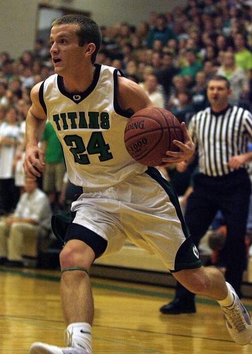 Djamila Grossman  |  The Salt Lake Tribune

Olympus High School's Jordan Marsh, 24, drives toward the basket during a game against Highland High School, at Olympus, Friday, Jan. 28, 2011. Highland won the game.