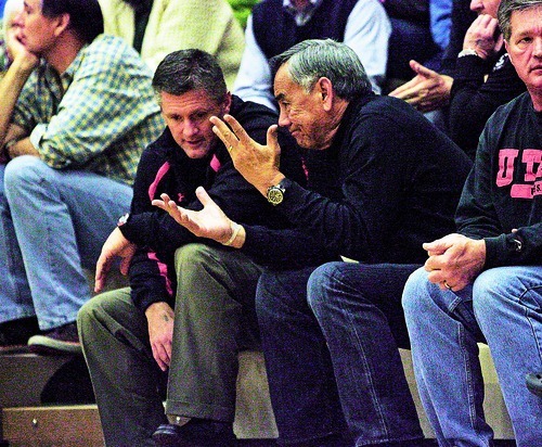 Djamila Grossman  |  The Salt Lake Tribune

University of Utah football head coach Kyle Whittingham talks to Utah offensive coordinator Norm Chow, during a basketball game between Olympus High School and Highland High School at Olympus, Friday, Jan. 28, 2011. Highland's Nate Fakahafua, 23, has committed to joining the University of Utah football team.