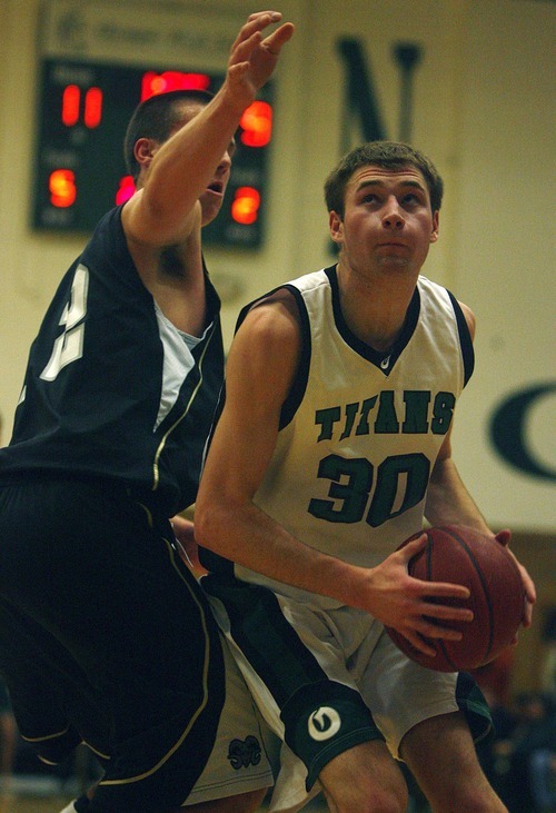 Djamila Grossman  |  The Salt Lake Tribune

Olympus High School's Will Cannon, 30, gets ready to shoot as Highland High School's Lew Evans, 12, guards him, during a game at Olympus, Friday, Jan. 28, 2011. Highland won the game.