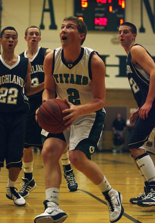 Djamila Grossman  |  The Salt Lake Tribune

Olympus High School's Tanner Curtis, 2, gets ready to shoot as several Highland High School players watch, during a game at Olympus, Friday, Jan. 28, 2011. Highland won the game.