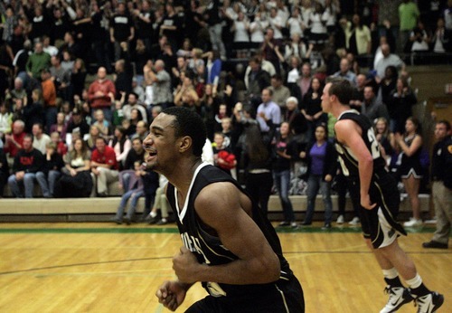 Djamila Grossman  |  The Salt Lake Tribune

Highland High School's Nate Fakahafua, 23, celebrates after his team won against Olympus High School during a game at Olympus, Friday, Jan. 28, 2011.