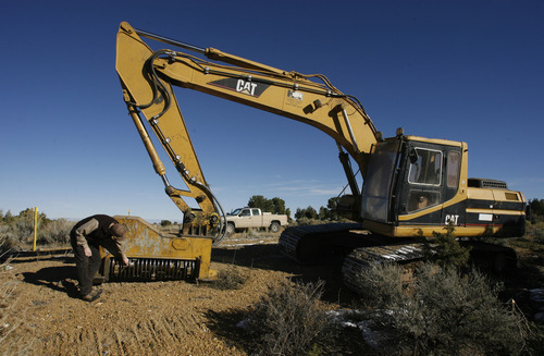 Rick Egan   |  The Salt Lake Tribune 
A cat with a special head to Bullhog an area, to remove junipers to help restore big-game habitat in the Book Cliffs area in Uintah, Grand, Counties,  Thursday, October 28, 2010.  The Book Cliffs are a relatively remote part of Utah that face increasing encroachments from oil, gas and tar sands developments.