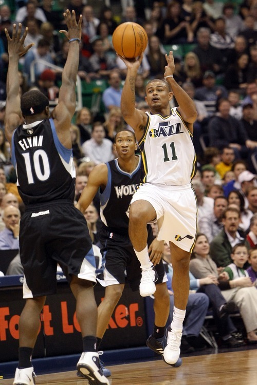 Chris Detrick  |  The Salt Lake Tribune 
Utah Jazz point guard Earl Watson #11 shoots over Minnesota Timberwolves point guard Jonny Flynn #10 during the first half of the game at EnergySolutions Arena Friday January 28, 2011.