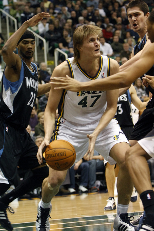 Chris Detrick  |  The Salt Lake Tribune 
Utah Jazz small forward Andrei Kirilenko #47 is guarded by Minnesota Timberwolves shooting guard Corey Brewer #22 Minnesota Timberwolves center Darko Milicic #31 and Minnesota Timberwolves small forward Wesley Johnson #4 during the first half of the game at EnergySolutions Arena Friday January 28, 2011.