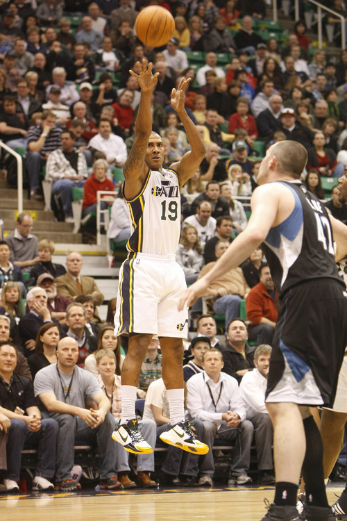 Chris Detrick  |  The Salt Lake Tribune 
Utah Jazz shooting guard Raja Bell #19 shoots over Minnesota Timberwolves power forward Kevin Love #42 during the first half of the game at EnergySolutions Arena Friday January 28, 2011.