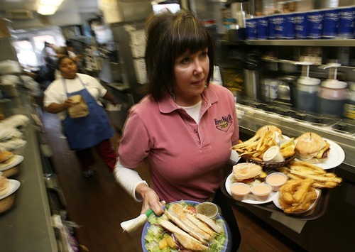 Francisco Kjolseth  |  Tribune file photo
Nancy Marks, daughter of Don Hale, the original owner of Hires Big H in Salt Lake City, carries out a large order of specialties during a lunch rush.