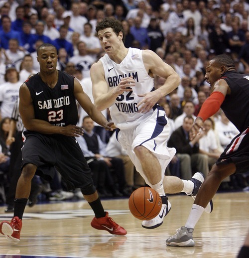 Steve Griffin  |  The Salt Lake Tribune
 
BYU guard Jimmer Fredette gets the ball stripped by San Diego State guard D.J. Gay during first half action of the BYU versus San Diego State men's basketball game at the Marriott Center in Provo Wednesday, January 26, 2011.