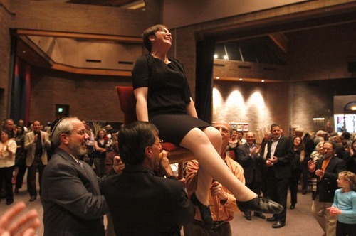 Rick Egan   |  The Salt Lake Tribune
Ilana Schwartzman is lifted up on a chair after installed as senior rabbi, during a special 