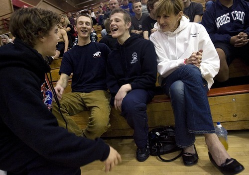 Djamila Grossman  |  The Salt Lake Tribune

Woods Cross High School senior Sasha Prosence, center laughs with his friend, Logan Stewart, left, his friend Danny Smith and his mom, Nancy Prosence after competing in a wrestling tournament at Bountiful High School, Friday, Jan. 28, 2011.
