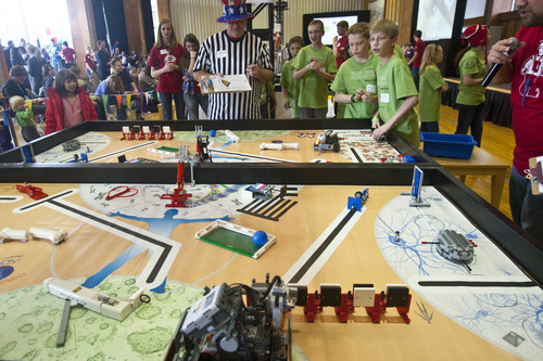 Chris Detrick  |  The Salt Lake Tribune 
Members of the Mega Nano Micro Chips watch as their robot competes during the Utah First Lego League Championship at the University of Utah Saturday January 29, 2011. Fifty-six junior-high-aged teams, 560 total kids, from across the state competed in contests using Lego robots they built.