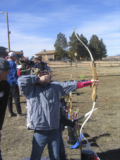Brett Prettyman | The Salt Lake Tribune
Tucker Francis, 10, prepares to shoot an arrow during the archery clinic at the annual Bryce Canyon Winter Festival.