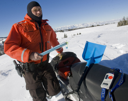 Al Hartmann  |  The Salt Lake Tribune 
Joe Donnell of Utah State Parks patrols the high country of the  Mill Hollow Snowmobile Complex east of Woodland.  His safety kit includes first aid kit and food in backpack, extra gas, snow shovel, avalanche probe pole, and avalanche beacon.