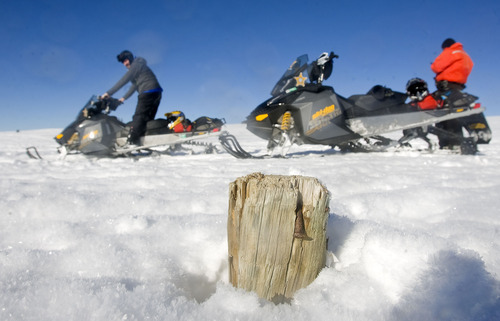 Al Hartmann  |  The Salt Lake Tribune 
Hazards like nearly buried fences and posts can cause accidents.  Riders have to have to pay attention and look for unexpected obstacles just beneath the surface of the snow.