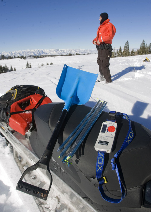 Al Hartmann  |  The Salt Lake Tribune 
Joe Donnell of Utah State Parks patrols the high country of the  Mill Hollow Snowmobile Complex east of Woodland.  His safety kit includes first aid kit and food in backpack, extra gas, snow shovel, avalanche probe pole, and avalanche beacon.