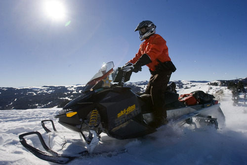 Al Hartmann  |  The Salt Lake Tribune 
Joe Donnell of Utah State Parks patrols the high country of the  Mill Hollow Snowmobile Complex east of Woodland.  His safety kit includes first aid kit and food in backpack, extra gas, snow shovel, avalanche probe pole, and avalanche beacon.