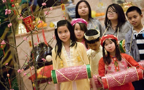 Djamila Grossman  |  The Salt Lake Tribune
The Vietnamese Community in Utah is celebrating the lunar New Year with a big festival. From left: Nhu Tran, 10, Rose Nguyen, 8, Amy Nguyen, 12, VT Nguyen, 9, Lan Anh Vu, 7, Anne Nguyen, 10, and Dean Pham, 10, gather at Lien Hoa Buddhist Temple in Taylorsville Sunday to practice a dance they will be performing during the festival.