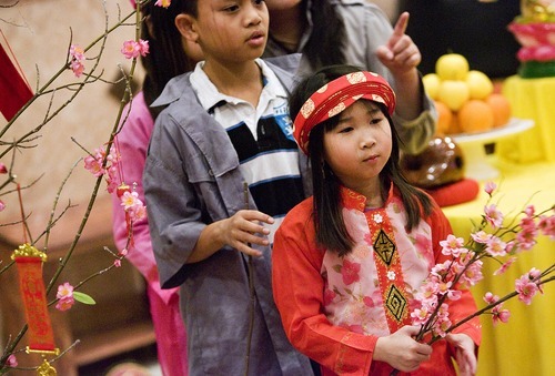 Djamila Grossman  |  The Salt Lake Tribune
The Vietnamese Community in Utah is celebrating the lunar New Year with a big festival. Lan Anh Vu, 7, and Dean Pham, 10, rehearse Sunday at Lien Hoa Buddhist Temple in Taylorsville.