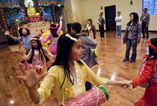 Djamila Grossman  |  The Salt Lake Tribune
The Vietnamese Community in Utah is celebrating the lunar New Year with a big festival. Nhu Tran, 10, and other children gather Sunday at Lien Hoa Buddhist Temple in Taylorsville to practice dance that they will be performing during the Tet celebration.