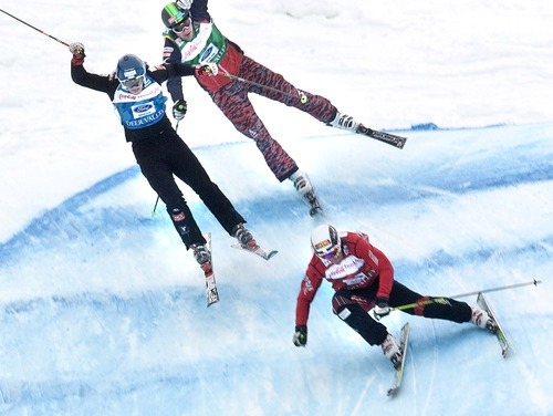 Paul Fraughton  |  The Salt Lake Tribune  

As Jouni Pellinen of Finland and Andreas Matt of Austria  bump one another as they land, Christopher Delbosco of Canada races to the finish line at the Ski Cross event at the FIS Freestyle World Ski Championships on  Friday, Feb. 4, 2011