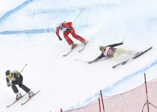 Paul Fraughton  |  The Salt Lake Tribune  Anna Woerner of Germany falls in her quarter final race  as  Karolina Riemen of Poland, front  and Katrin Mueller  of Switzerland  ski past.  on  Friday,February 4, 2011
