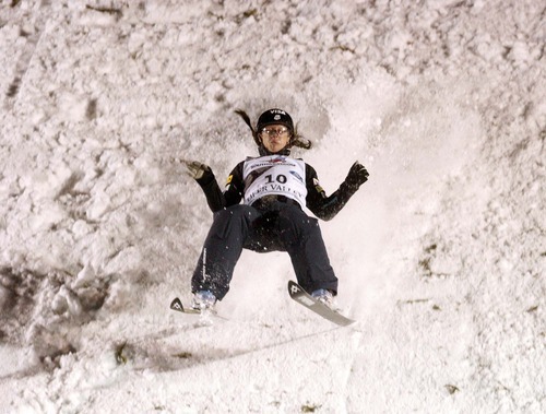 Trent Nelson  |  The Salt Lake Tribune
USA skier Emily Cook lands hard on her second jump in the FIS Freestyle World Ski Championships, Aerials Final at Deer Valley, Utah, Friday, February 4, 2011.