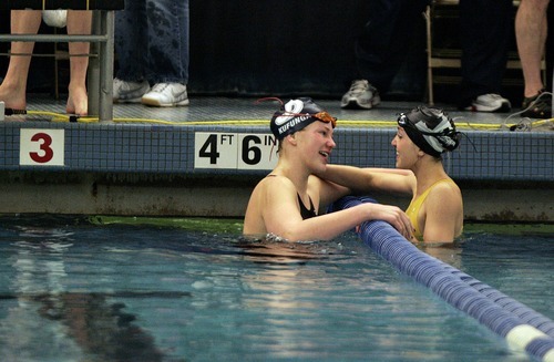 Djamila Grossman  |  The Salt Lake Tribune

Juan Diego High School's Kelsey Leeson gets a hug from Desert Hills High School's Krissia Beatty after winning the 50 Yard Freestyle in the 3A Swimming Championship at Brigham Young University, Friday, Feb. 4, 2010.